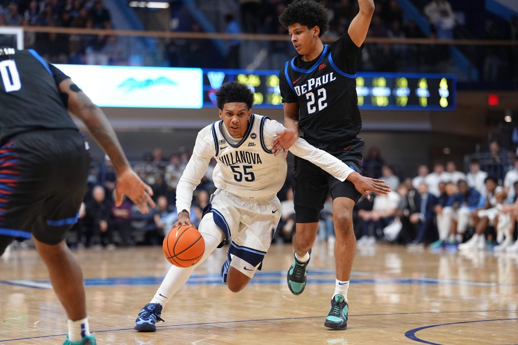 Dec 31, 2025; Villanova, Pennsylvania, USA; Villanova Wildcats guard Acaden Lewis (55) drives against DePaul Blue Demons guard Kruz McClure (22) in the first half at William B. Finneran Pavilion. Mandatory Credit: Kyle Ross-Imagn Images
