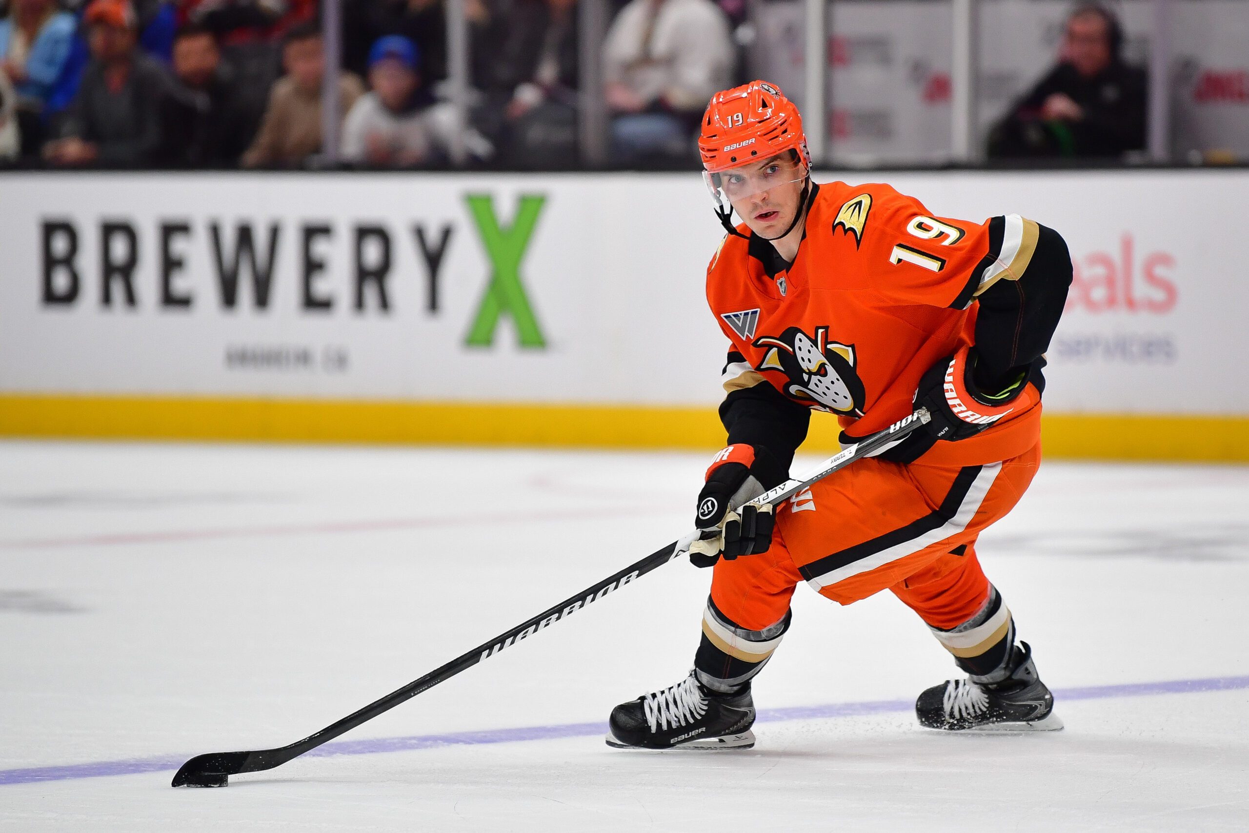 Dec 31, 2025; Anaheim, California, USA; Anaheim Ducks right wing Troy Terry (19) moves the puck against the Tampa Bay Lightning during the overtime period at Honda Center. Mandatory Credit: Gary A. Vasquez-Imagn Images