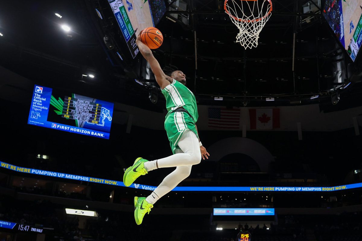 Dec 31, 2025; Memphis, Tennessee, USA; North Texas Mean Green guard David Terrell Jr. (5) dunks the ball against the Memphis Tigers during the second half at FedExForum. Mandatory Credit: Wesley Hale-Imagn Images