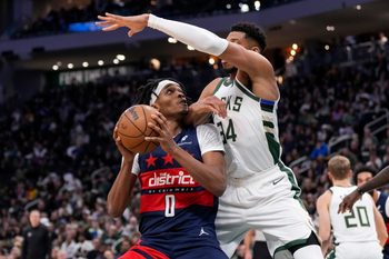 Dec 31, 2025; Milwaukee, Wisconsin, USA;  Washington Wizards guard Bilal Coulibaly (0) looks to shoot against Milwaukee Bucks forward Giannis Antetokounmpo (34) during the fourth quarter at Fiserv Forum. Mandatory Credit: Jeff Hanisch-Imagn Images
