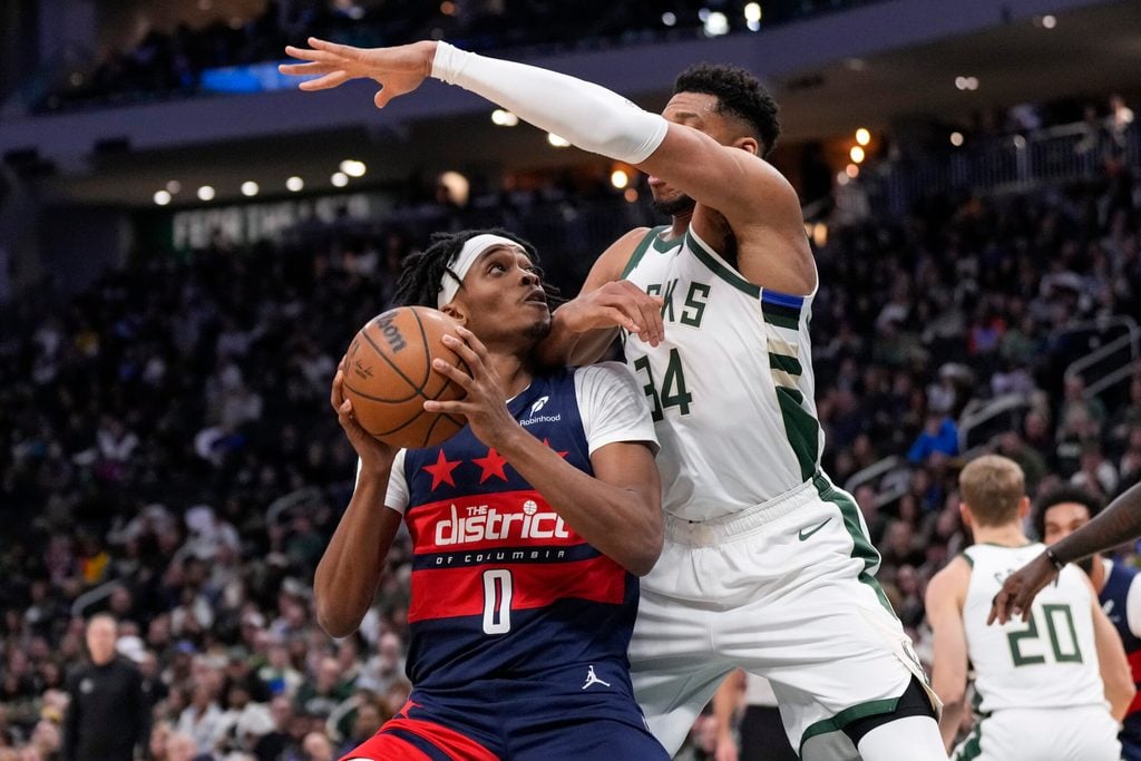Dec 31, 2025; Milwaukee, Wisconsin, USA; Washington Wizards guard Bilal Coulibaly (0) looks to shoot against Milwaukee Bucks forward Giannis Antetokounmpo (34) during the fourth quarter at Fiserv Forum. Mandatory Credit: Jeff Hanisch-Imagn Images