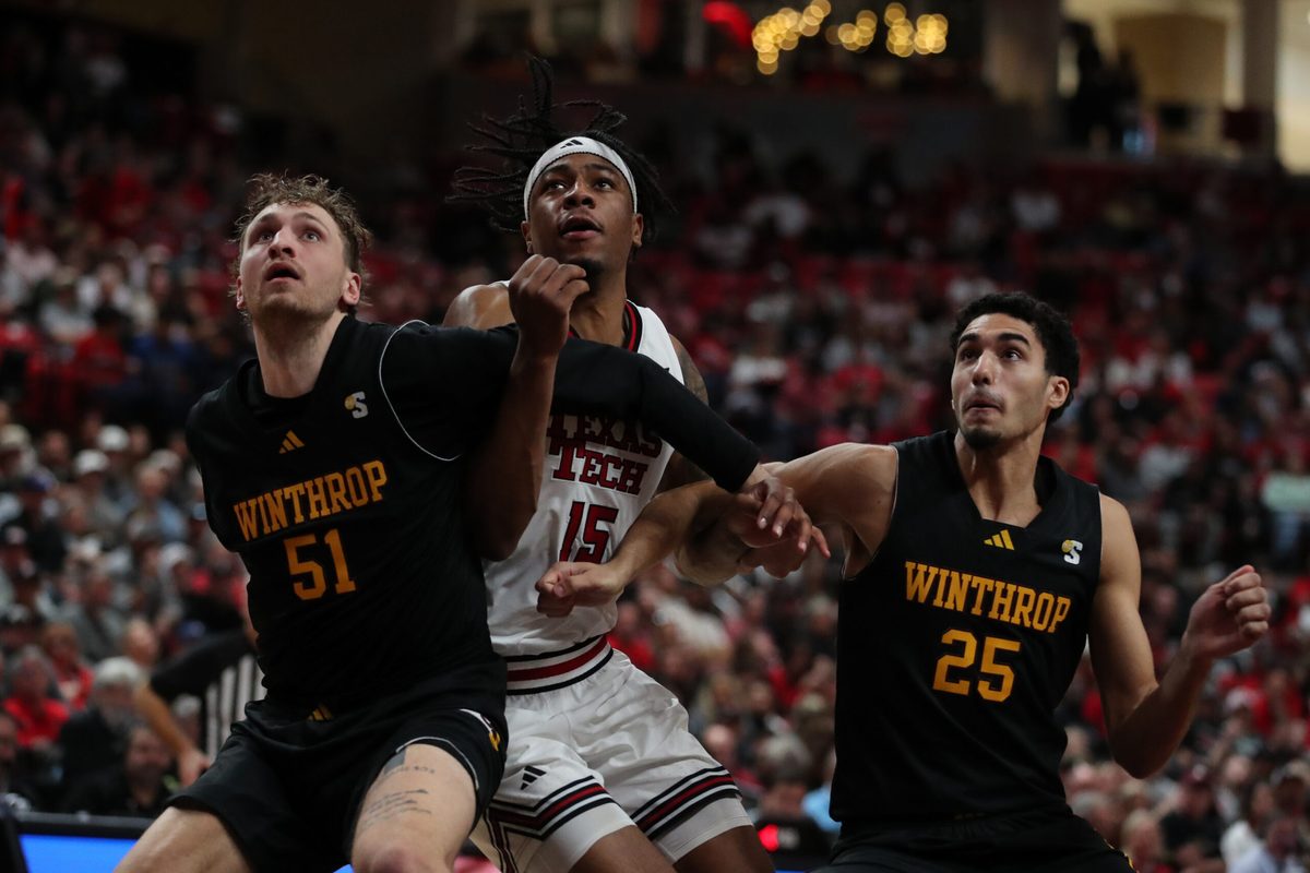 Dec 28, 2025; Lubbock, Texas, USA; Winthrop Eagles center Logan Duncomb (51) and guard Seifeldin Hendawy (25) fight for position against Texas Tech Red Raiders forward JT Toppin (15) in the second half at United Supermarkets Arena. Mandatory Credit: Michael C. Johnson-Imagn Images