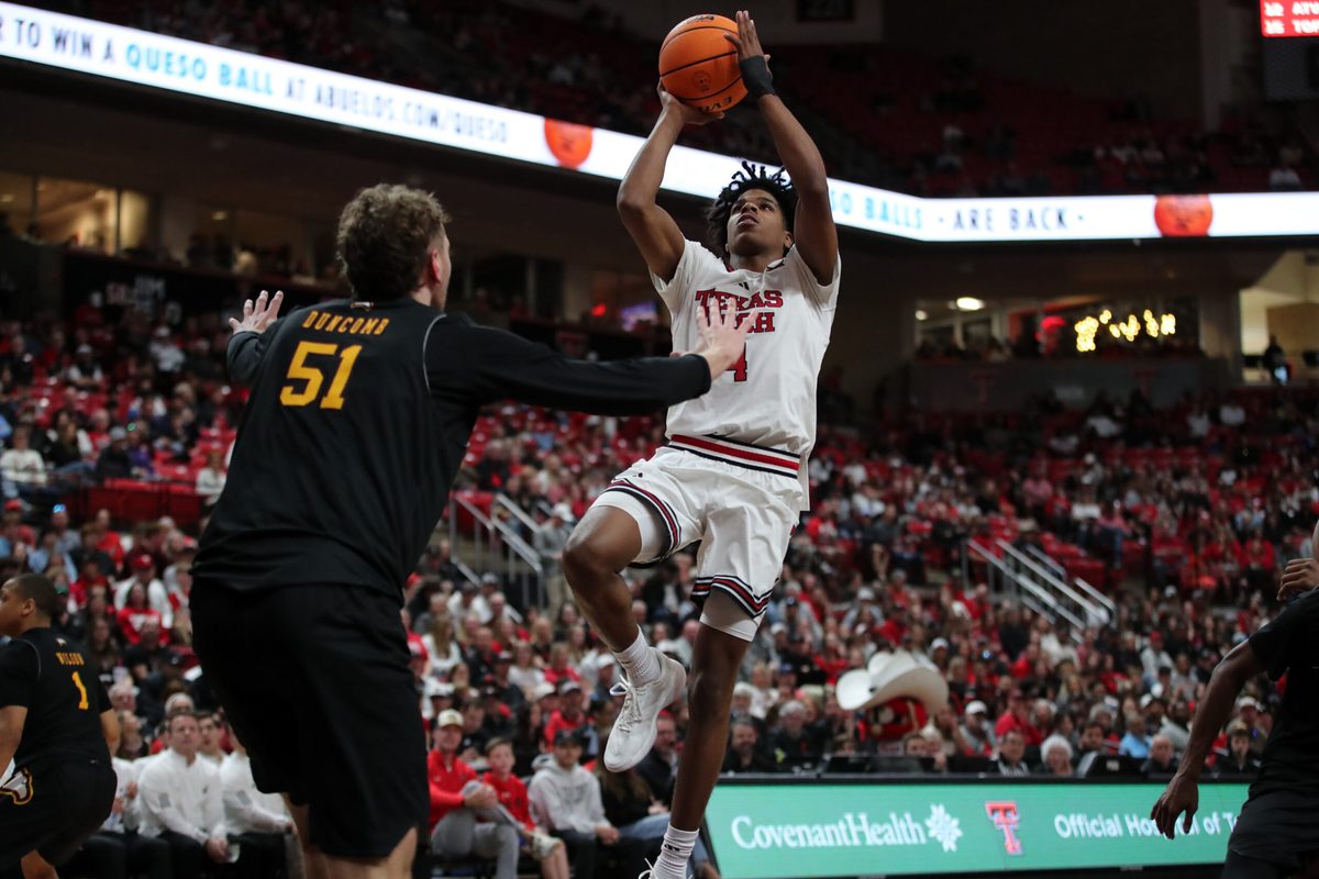 Dec 28, 2025; Lubbock, Texas, USA; Texas Tech Red Raiders guard Christian Anderson (4) goes to the basket against Winthrop Eagles center Logan Duncomb (51) in the second half at United Supermarkets Arena. Mandatory Credit: Michael C. Johnson-Imagn Images