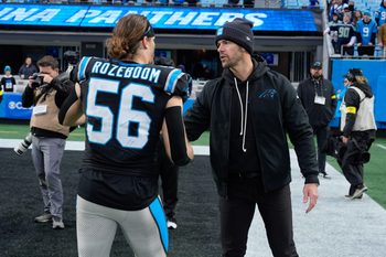 Dec 28, 2025; Charlotte, North Carolina, USA; Carolina Panthers head coach Dave Canales thanks linebacker Christian Rozeboom (56) during the second half at Bank of America Stadium. Mandatory Credit: Jim Dedmon-Imagn Images
