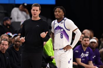 Jan 1, 2026; Inglewood, California, USA;  Utah Jazz Head Coach Will Hardy (left) talks with guard Isaiah Collier (8) during the first half against the Los Angeles Clippers at Intuit Dome. Mandatory Credit: Kiyoshi Mio-Imagn Images
