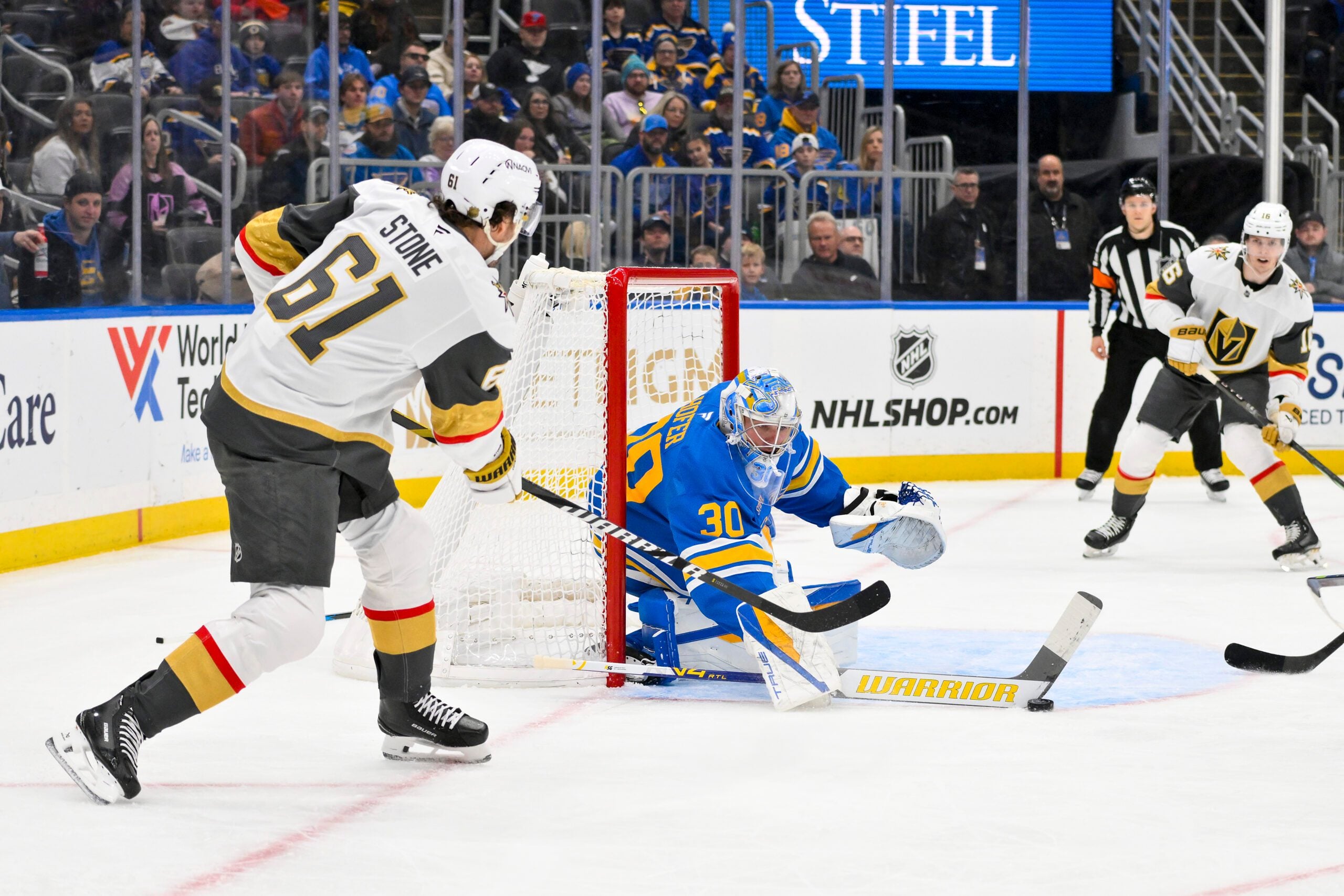 Jan 2, 2026; St. Louis, Missouri, USA; St. Louis Blues goaltender Joel Hofer (30) defends the net against Vegas Golden Knights right wing Mark Stone (61) during the first period at Enterprise Center. Mandatory Credit: Jeff Curry-Imagn Images
