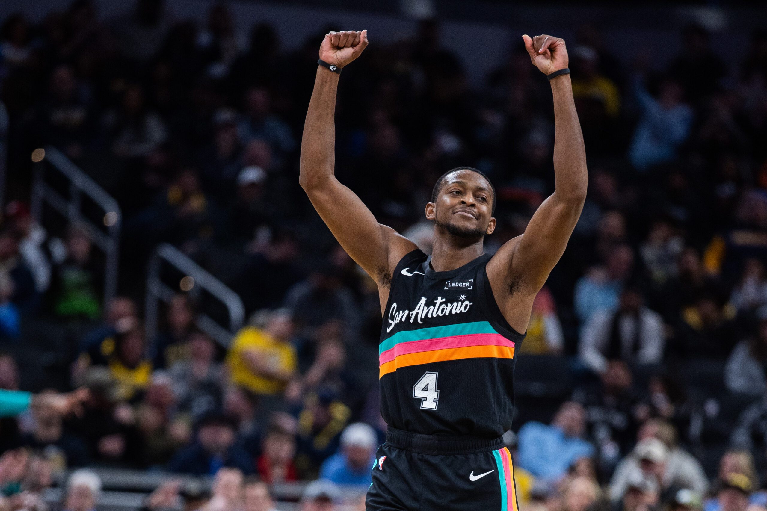 Jan 2, 2026; Indianapolis, Indiana, USA;  San Antonio Spurs guard De'Aaron Fox (4) celebrates a made basket in the second half against the Indiana Pacers at Gainbridge Fieldhouse. Mandatory Credit: Trevor Ruszkowski-Imagn Images