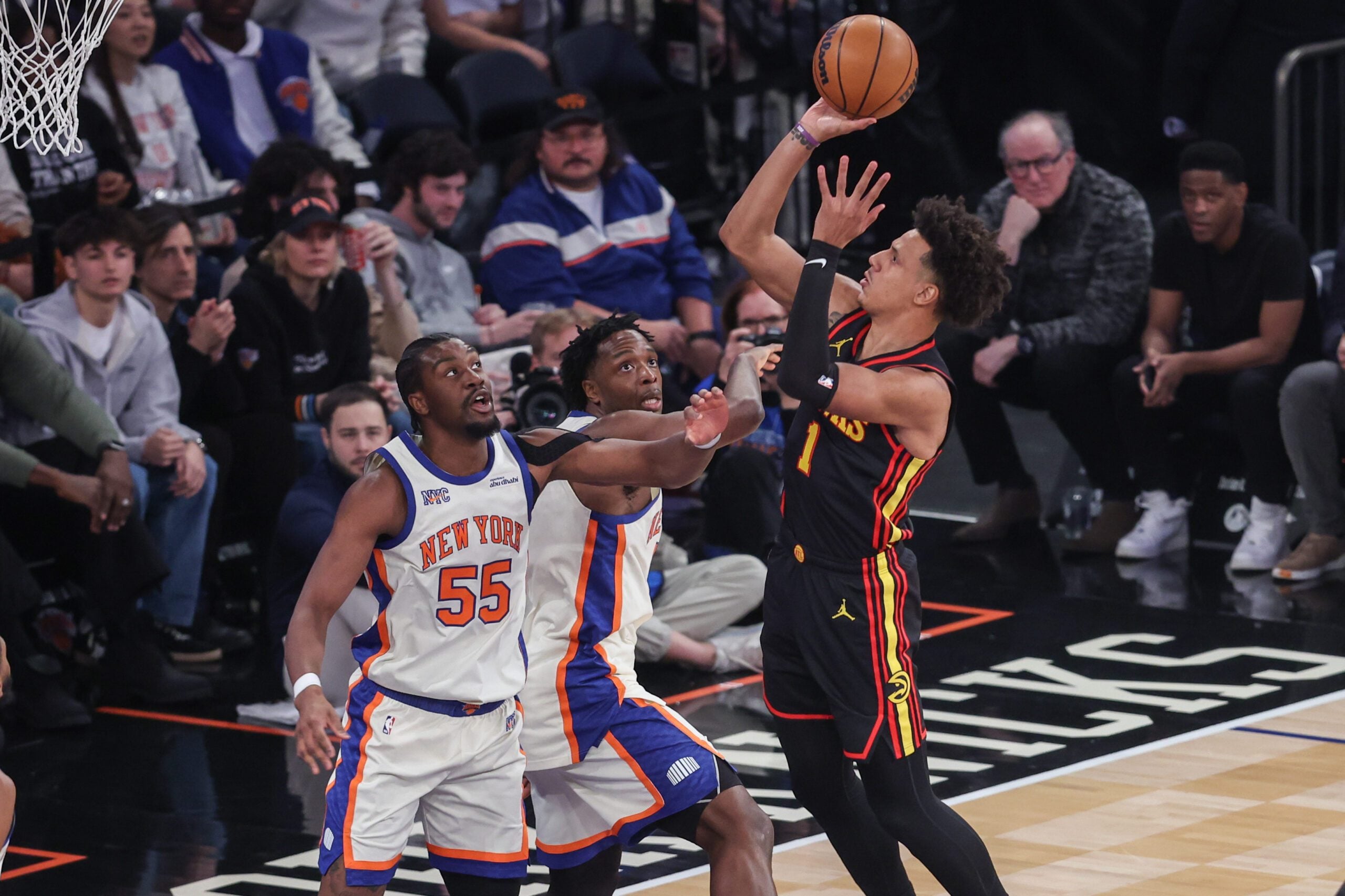 Jan 2, 2026; New York, New York, USA;  Atlanta Hawks forward Jalen Johnson (1) shoots past New York Knicks center Ariel Hukporti (55) and forward Og Anunoby (8) in the first quarter at Madison Square Garden. Mandatory Credit: Wendell Cruz-Imagn Images