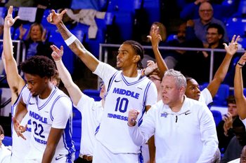 Middle Tennessee forward Kamari Lands (22), Middle Tennessee forward Torey Alston (10) and Middle Tennessee assistant coach Wes Long celebrate a 3 point shot late in the men's NCAA game against Louisiana Tech on Friday, Jan. 2, 2026, at MTSU.