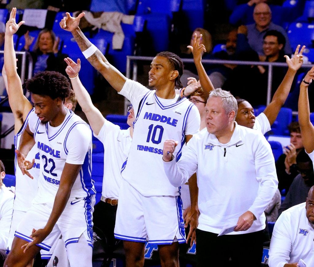 Middle Tennessee forward Kamari Lands (22), Middle Tennessee forward Torey Alston (10) and Middle Tennessee assistant coach Wes Long celebrate a 3 point shot late in the men's NCAA game against Louisiana Tech on Friday, Jan. 2, 2026, at MTSU.