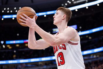 Jan 2, 2026; Chicago, Illinois, USA; Chicago Bulls guard Kevin Huerter (13) shoots against the Orlando Magic during the first half at United Center. Mandatory Credit: Kamil Krzaczynski-Imagn Images