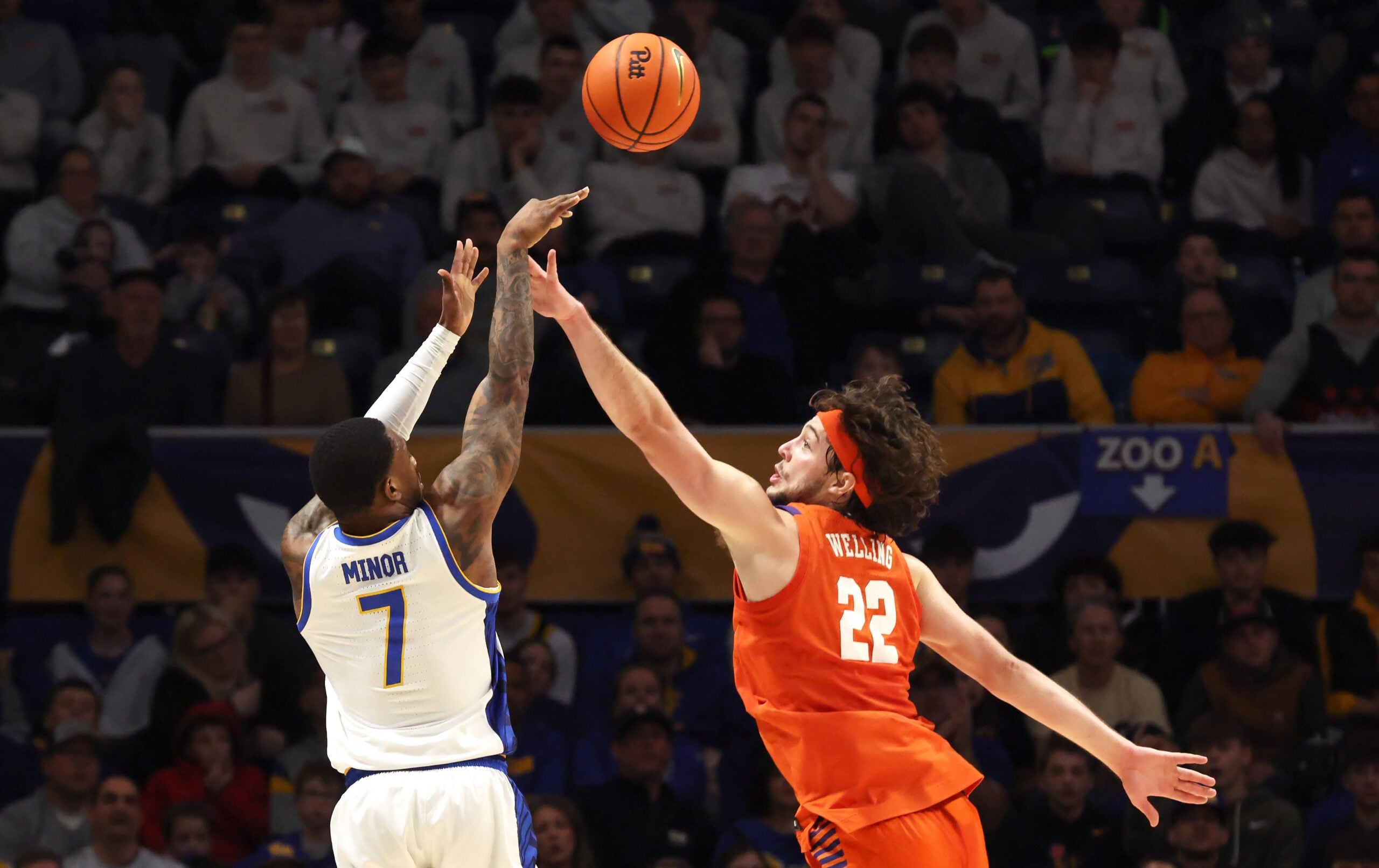 Jan 3, 2026; Pittsburgh, Pennsylvania, USA;  Pittsburgh Panthers guard Damarco Minor (7) shoots a three point basket against Clemson Tigers center Carter Welling (22) during the second half at the Petersen Events Center. Mandatory Credit: Charles LeClaire-Imagn Images