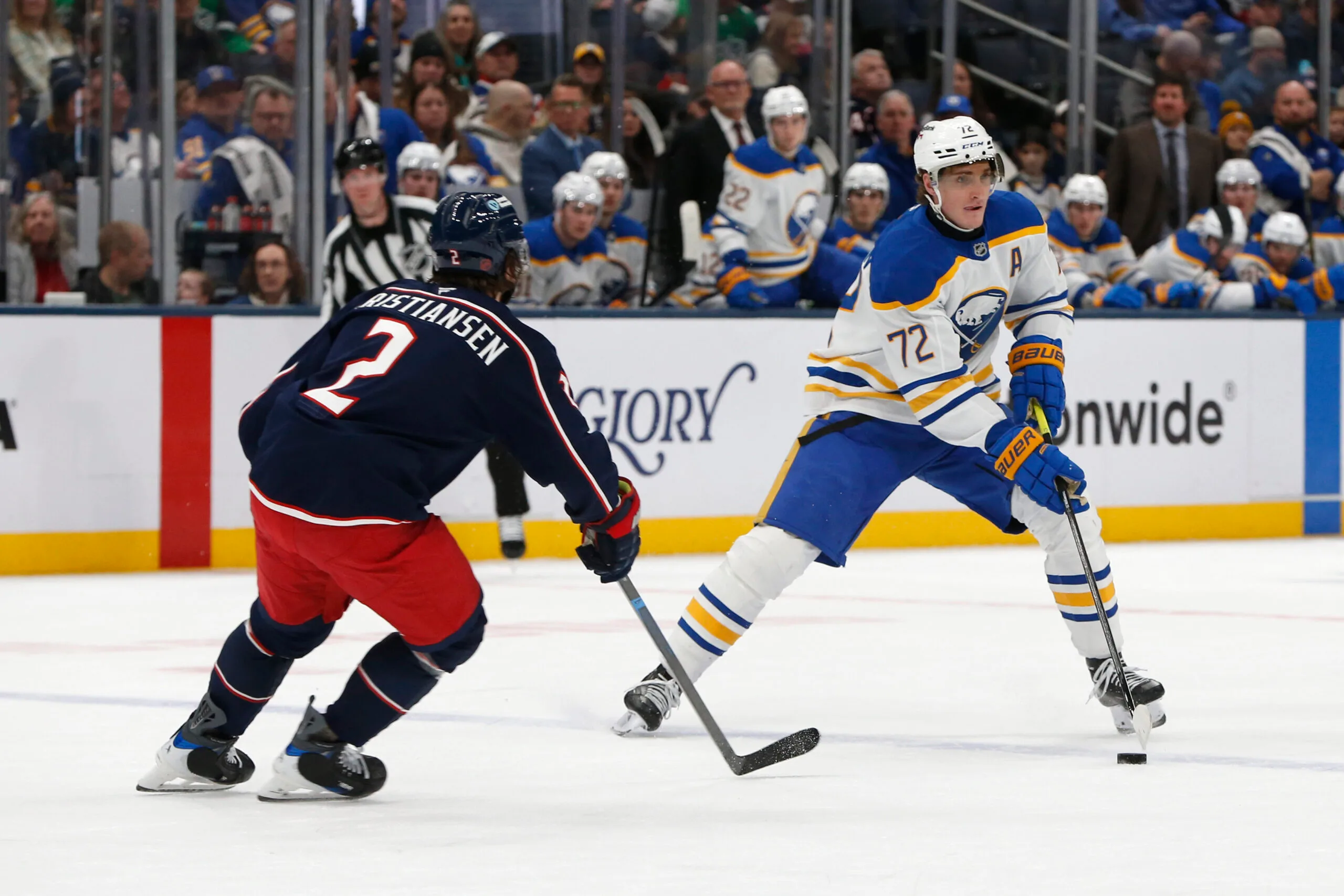 Jan 3, 2026; Columbus, Ohio, USA; Buffalo Sabres center Tage Thompson (72) carries the puck as Columbus Blue Jackets defenseman Jake Christiansen (2) defends during the third period at Nationwide Arena. Mandatory Credit: Russell LaBounty-Imagn Images