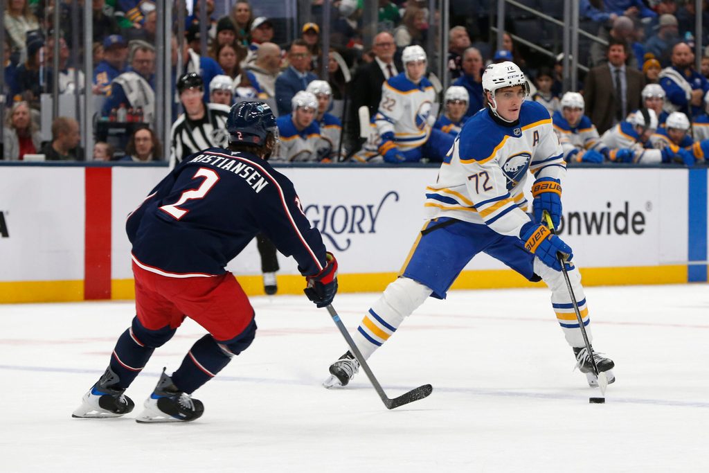 Jan 3, 2026; Columbus, Ohio, USA; Buffalo Sabres center Tage Thompson (72) carries the puck as Columbus Blue Jackets defenseman Jake Christiansen (2) defends during the third period at Nationwide Arena. Mandatory Credit: Russell LaBounty-Imagn Images