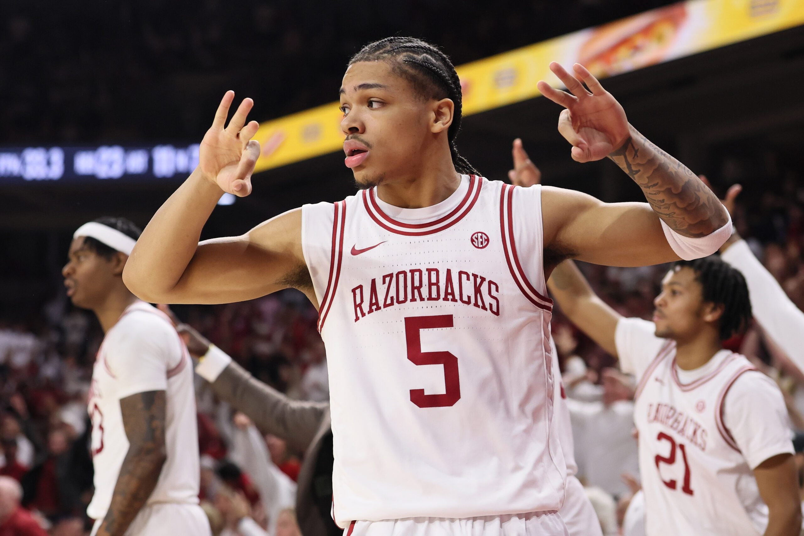 Jan 3, 2026; Fayetteville, Arkansas, USA; Arkansas Razorbacks guard Darius Acuff Jr (5) reacts to a made three by a teammate during the second half against the Tennessee Volunteers at Bud Walton Arena. Mandatory Credit: Nelson Chenault-Imagn Images