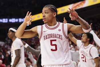 Jan 3, 2026; Fayetteville, Arkansas, USA; Arkansas Razorbacks guard Darius Acuff Jr (5) reacts to a made three by a teammate during the second half against the Tennessee Volunteers at Bud Walton Arena. Mandatory Credit: Nelson Chenault-Imagn Images