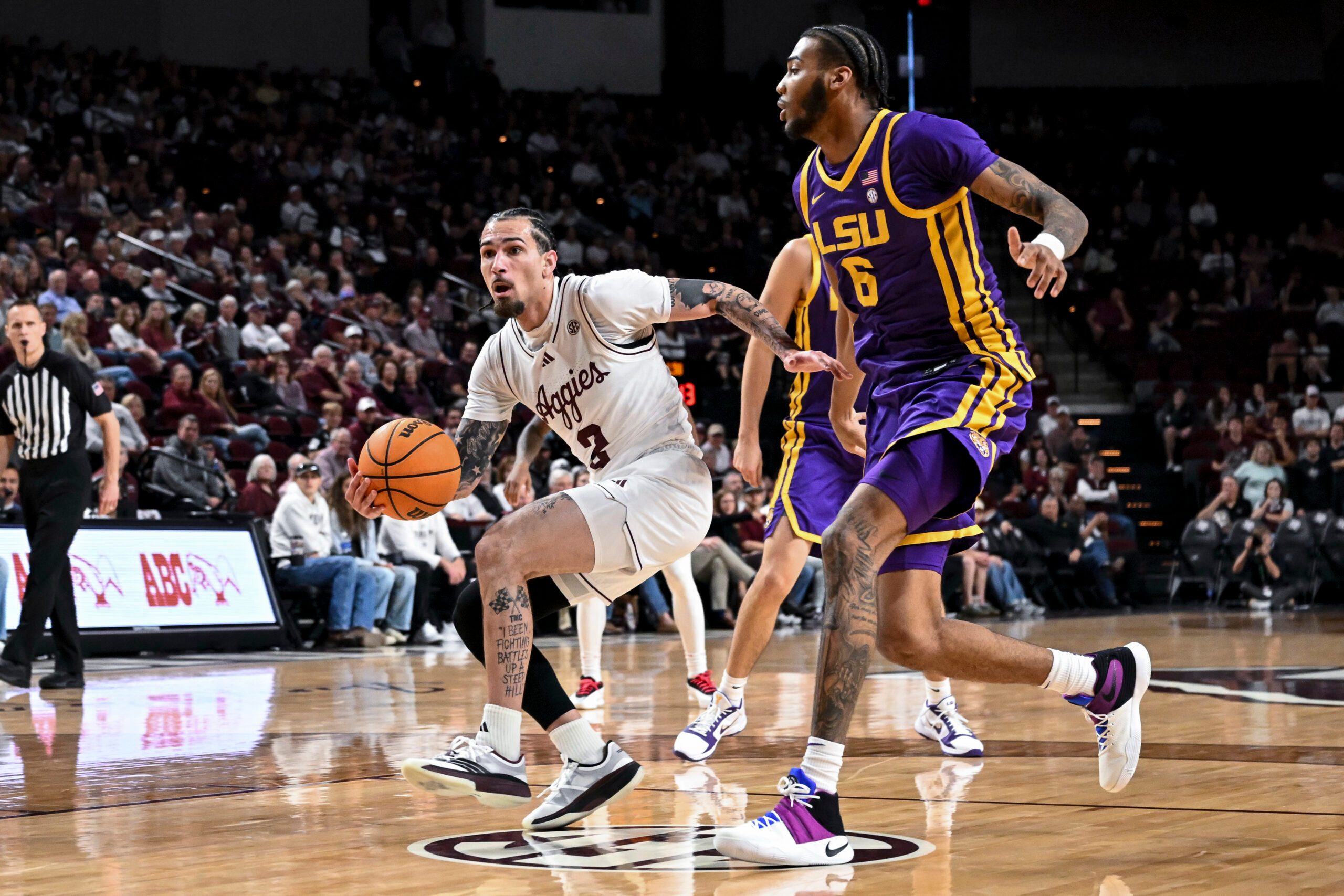 Jan 3, 2026; College Station, Texas, USA; Texas A&M Aggies guard Pop Isaacs (2) drives to the basket against the Louisiana State Tigers at Reed Arena. Mandatory Credit: Maria Lysaker-Imagn Images