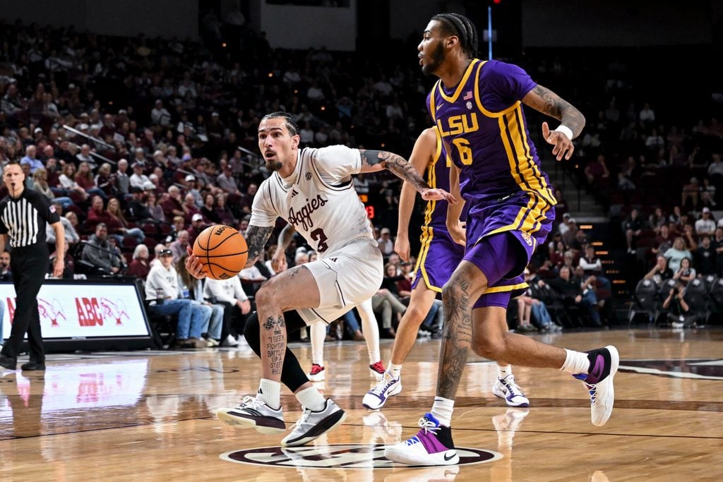 Jan 3, 2026; College Station, Texas, USA; Texas A&M Aggies guard Pop Isaacs (2) drives to the basket against the Louisiana State Tigers at Reed Arena. Mandatory Credit: Maria Lysaker-Imagn Images
