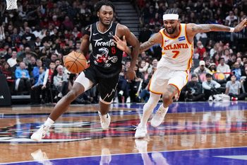 Jan 3, 2026; Toronto, Ontario, CAN; Toronto Raptors guard Immanuel Quickley (5) controls the ball as Atlanta Hawks guard Nickeil Alexander-Walker (7) tries to defend during the fourth quarter at Scotiabank Arena. Mandatory Credit: Nick Turchiaro-Imagn Images