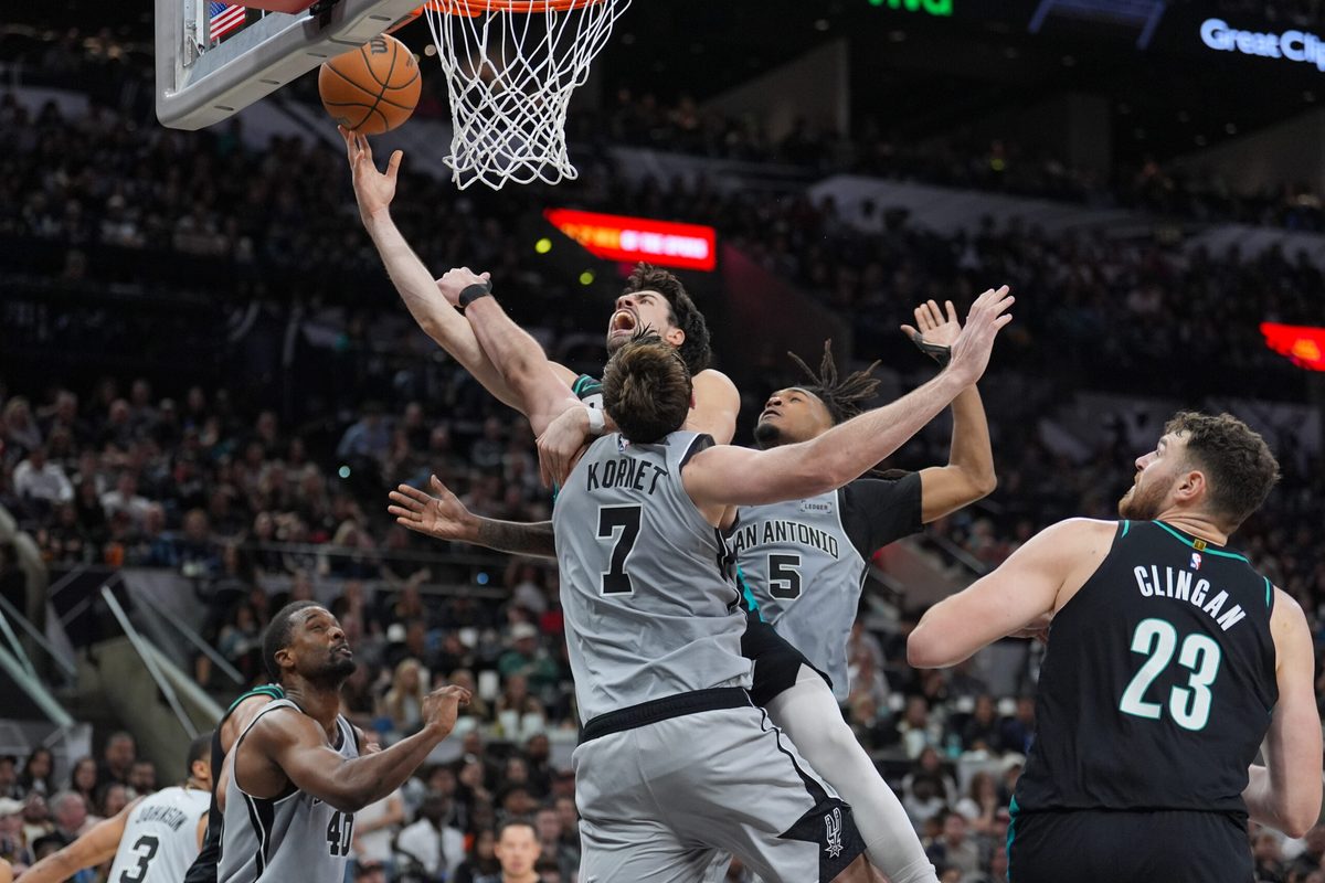 Jan 3, 2026; San Antonio, Texas, USA;  Portland Trail Blazers forward Deni Avdija (8) shoots against San Antonio Spurs center/forward Luke Kornet (7) in the second half at Frost Bank Center. Mandatory Credit: Daniel Dunn-Imagn Images