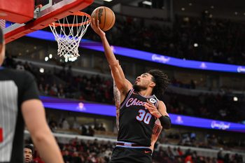 Jan 3, 2026; Chicago, Illinois, USA; Chicago Bulls guard Tre Jones (30) goes up for a shot against the Charlotte Hornets during the second half at United Center. Mandatory Credit: Patrick Gorski-Imagn Images