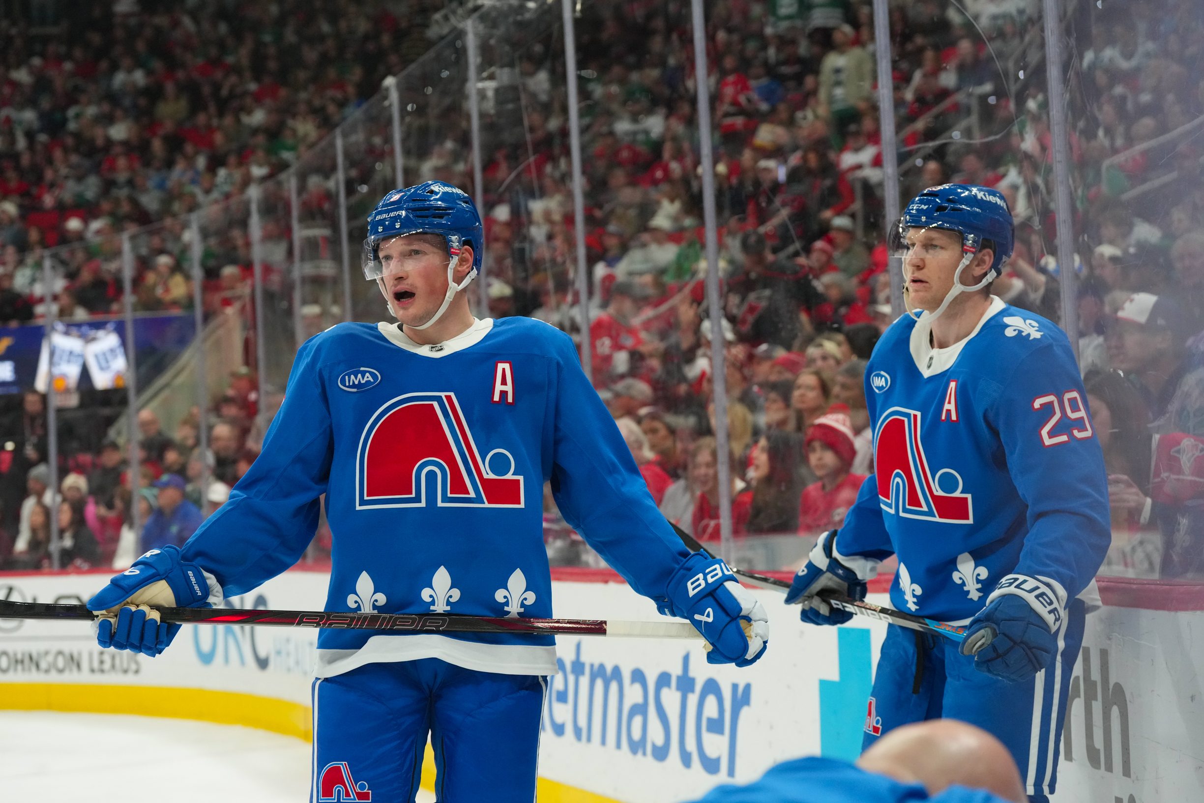 Jan 3, 2026; Raleigh, North Carolina, USA; Colorado Avalanche defenseman Cale Makar (8) and center Nathan MacKinnon (29) look on during the third period against the Carolina Hurricanes at Lenovo Center. Mandatory Credit: James Guillory-Imagn Images