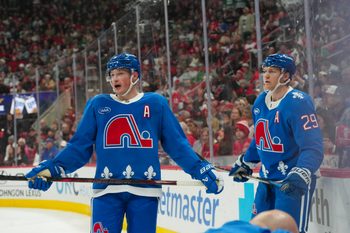Jan 3, 2026; Raleigh, North Carolina, USA; Colorado Avalanche defenseman Cale Makar (8) and center Nathan MacKinnon (29) look on during the third period against the Carolina Hurricanes at Lenovo Center. Mandatory Credit: James Guillory-Imagn Images