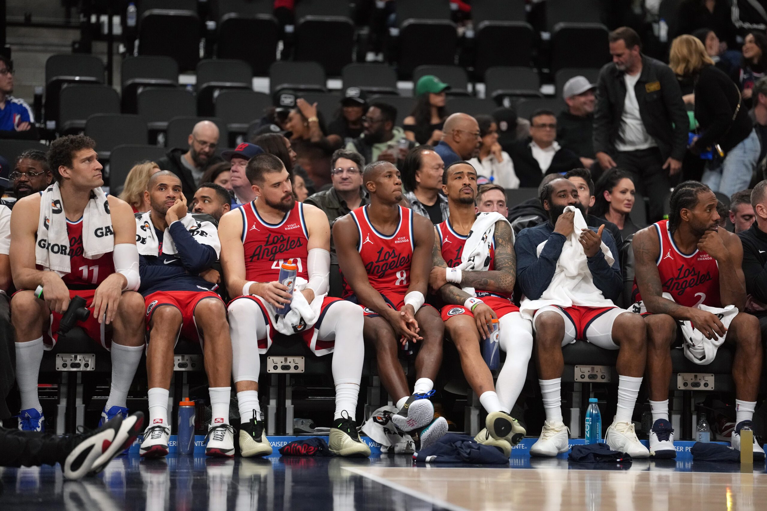 Jan 3, 2026; Inglewood, California, USA; LA Clippers players watch from the bench in the fourth quarter against the Boston Celtics at the Intuit Dome. Mandatory Credit: Kirby Lee-Imagn Images