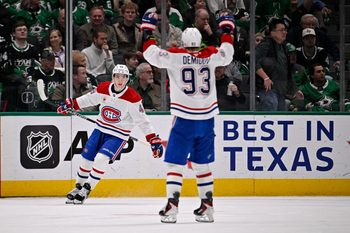 Jan 4, 2026; Dallas, Texas, USA; Montreal Canadiens defenseman Lane Hutson (48) and right wing Ivan Demidov (93) celebrates Hutson scoring the game winning goal against the Dallas Stars during the overtime period at the American Airlines Center. Mandatory Credit: Jerome Miron-Imagn Images