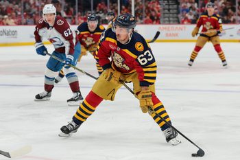 Jan 4, 2026; Sunrise, Florida, USA; Florida Panthers left wing Brad Marchand (63) moves the puck against the Colorado Avalanche during the first period at Amerant Bank Arena. Mandatory Credit: Sam Navarro-Imagn Images