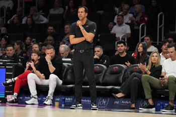 Jan 4, 2026; Miami, Florida, USA;  Miami Heat head coach Erik Spoelstra keeps his eyes on his team during the first half at Kaseya Center against the New Orleans Pelicans. Mandatory Credit: Jim Rassol-Imagn Images