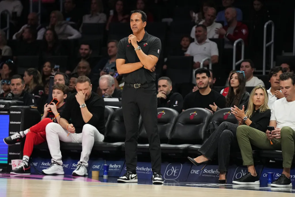 Jan 4, 2026; Miami, Florida, USA; Miami Heat head coach Erik Spoelstra keeps his eyes on his team during the first half at Kaseya Center against the New Orleans Pelicans. Mandatory Credit: Jim Rassol-Imagn Images