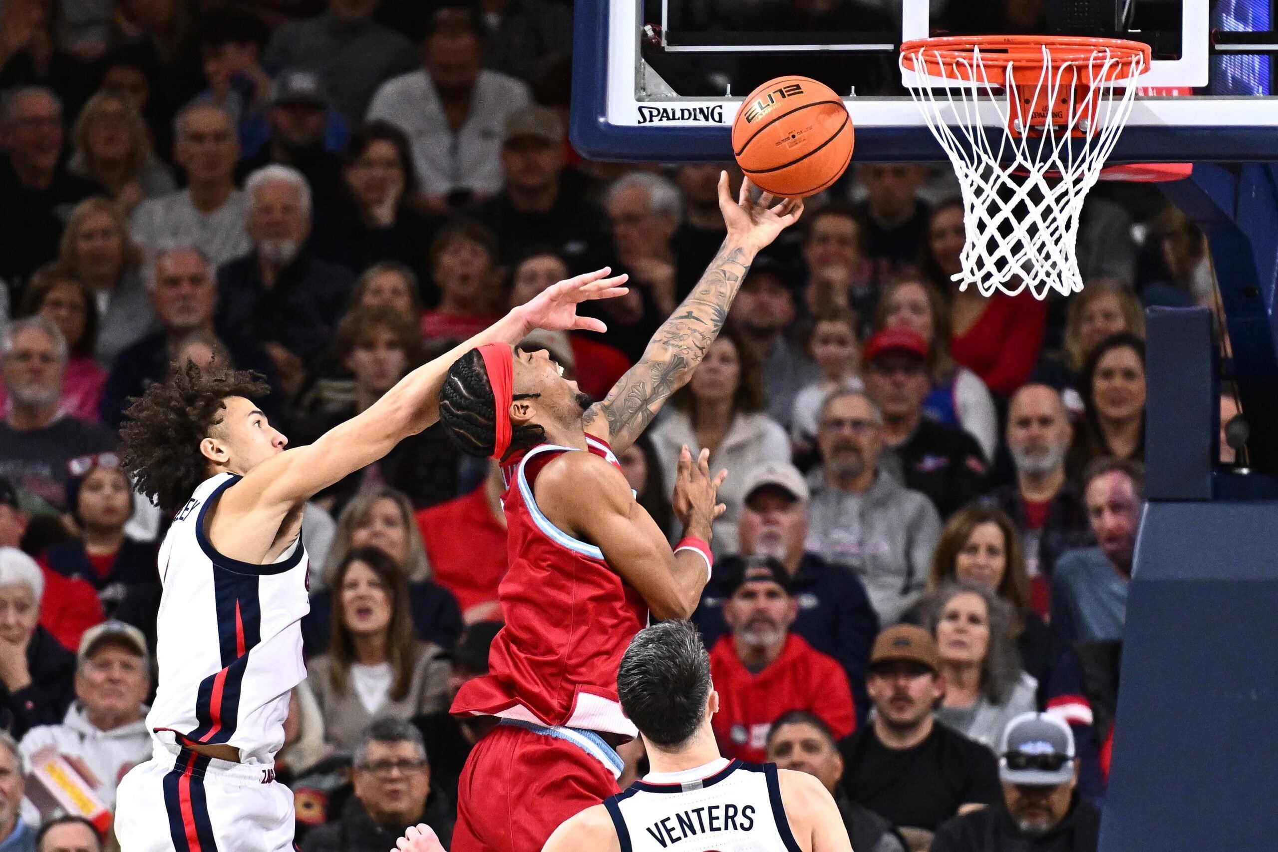 Jan 4, 2026; Spokane, Washington, USA; Loyola Marymount Lions forward Jalen Shelley (1) shoots the ball against Gonzaga Bulldogs guard Jalen Warley (8) in the second half at McCarthey Athletic Center. Mandatory Credit: James Snook-Imagn Images