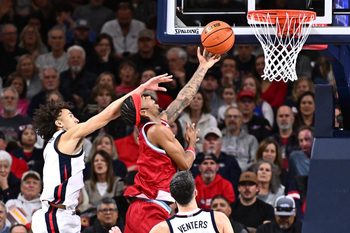 Jan 4, 2026; Spokane, Washington, USA; Loyola Marymount Lions forward Jalen Shelley (1) shoots the ball against Gonzaga Bulldogs guard Jalen Warley (8) in the second half at McCarthey Athletic Center. Mandatory Credit: James Snook-Imagn Images