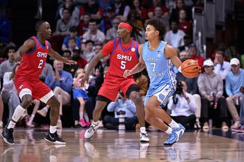 Jan 3, 2026; Dallas, Texas, USA; North Carolina Tar Heels guard Seth Trimble (7) looks to pass the ball by SMU Mustangs guard Jaron Pierre Jr. (5) and guard Boopie Miller (2) during the game between the Mustangs and the Tar Heels at Moody Coliseum. Mandatory Credit: Jerome Miron-Imagn Images