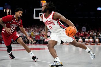 Ohio State Buckeyes guard Bruce Thornton (2) dribbles around Nebraska Cornhuskers guard Jamarques Lawrence (10) during the second half of the NCAA men's basketball game at the Schottenstein Center in Columbus on Jan. 5, 2026. Ohio State lost 72-69.