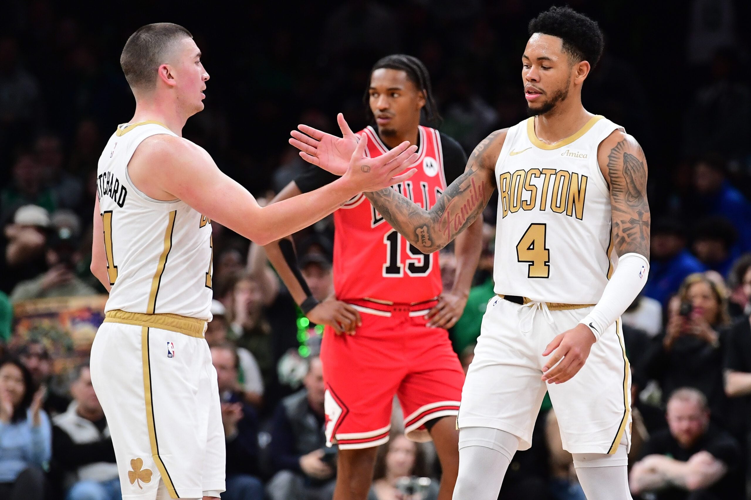 Jan 5, 2026; Boston, Massachusetts, USA; Boston Celtics guard Payton Pritchard (11) congratulates guard Anfernee Simons (4) after a basket during the second half against the Chicago Bulls at TD Garden. Mandatory Credit: Bob DeChiara-Imagn Images