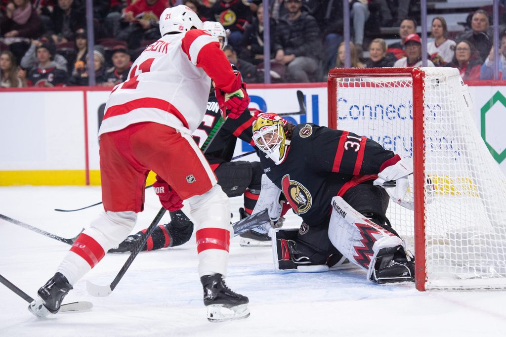 Jan 5, 2026; Ottawa, Ontario, CAN; Detroit Red Wings left wing James van Riemsdyk (21) shoots on Ottawa Senators goalie Hunter Shepard (31) in the second period at the Canadian Tire Centre. Mandatory Credit: Marc DesRosiers-IMAGN Images