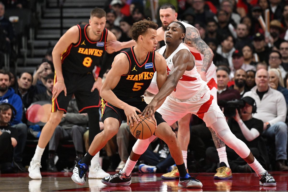 Jan 5, 2026; Toronto, Ontario, CAN; Toronto Raptors forward RJ Barrett (9) knocks the ball from the grasp of Atlanta Hawks guard Dyson Daniels (5) in the second half at Scotiabank Arena. Mandatory Credit: Dan Hamilton-Imagn Images