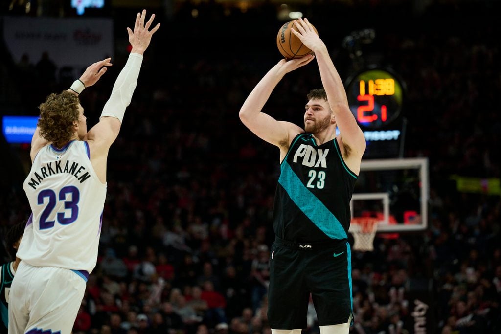 Jan 5, 2026; Portland, Oregon, USA; Portland Trail Blazers center Donovan Clingan (23) shoots a jump shot during the second half against Utah Jazz forward Lauri Markkanen (23) at Moda Center. Mandatory Credit: Troy Wayrynen-Imagn Images