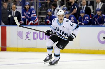 Jan 5, 2026; New York, New York, USA; Utah Mammoth right wing Dylan Guenther (11) skates against the New York Rangers during the first period at Madison Square Garden. Mandatory Credit: Brad Penner-Imagn Images