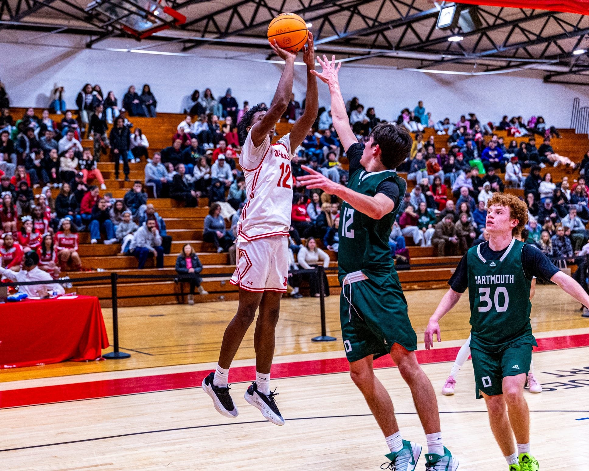 New Bedford's Samajae Ivy hits the baseline shot as New Bedford more then double up Dartmouth 89-44 at home on Monday, January 5th.