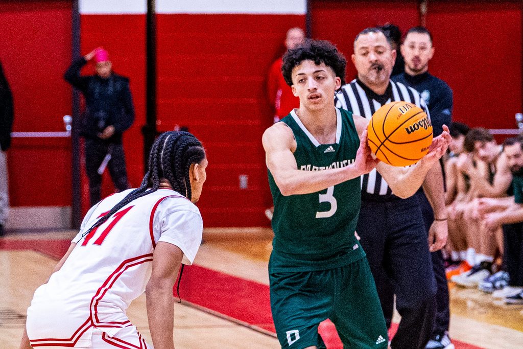 Dartmouth’s Ayden Valentin moves the ball around the court as New Bedford more then double up Dartmouth 89-44 at home on Monday, January 5th.