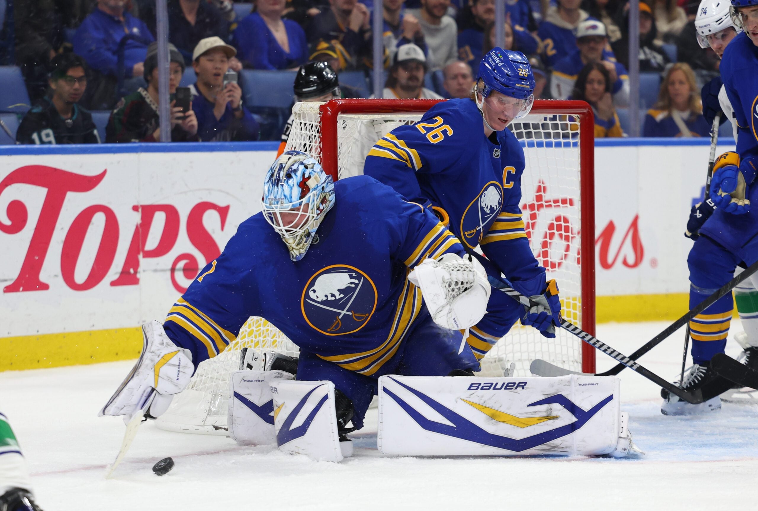 Jan 6, 2026; Buffalo, New York, USA;  Buffalo Sabres defenseman Rasmus Dahlin (26) watches as goaltender Ukko-Pekka Luukkonen (1) looks to cover up the puck during the third periodagainst the Vancouver Canucks at KeyBank Center. Mandatory Credit: Timothy T. Ludwig-Imagn Images