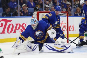 Jan 6, 2026; Buffalo, New York, USA;  Buffalo Sabres defenseman Rasmus Dahlin (26) watches as goaltender Ukko-Pekka Luukkonen (1) looks to cover up the puck during the third periodagainst the Vancouver Canucks at KeyBank Center. Mandatory Credit: Timothy T. Ludwig-Imagn Images