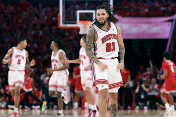 Jan 6, 2026; Houston, Texas, USA; Houston Cougars guard Emanuel Sharp (21) reacts after scoring a basket during the first half against the Texas Tech Red Raiders at Fertitta Center. Mandatory Credit: Troy Taormina-Imagn Images