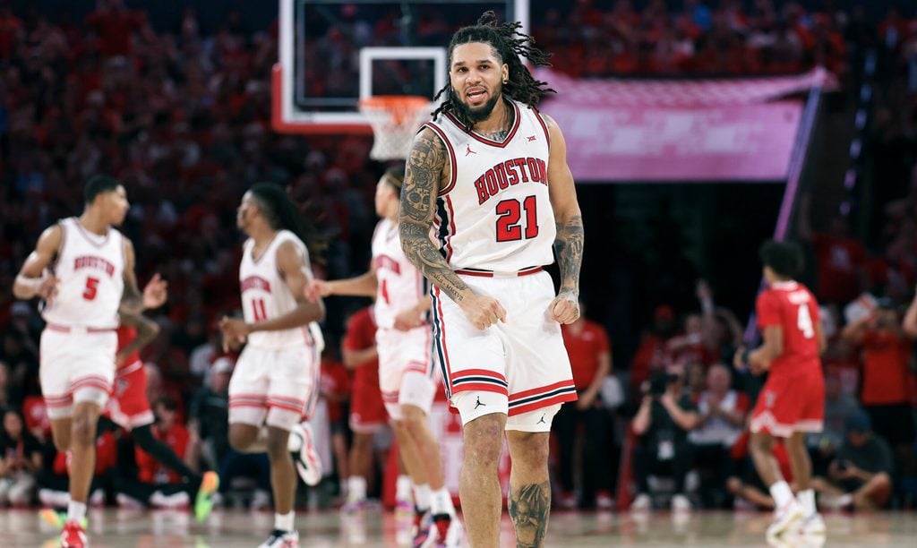 Jan 6, 2026; Houston, Texas, USA; Houston Cougars guard Emanuel Sharp (21) reacts after scoring a basket during the first half against the Texas Tech Red Raiders at Fertitta Center. Mandatory Credit: Troy Taormina-Imagn Images