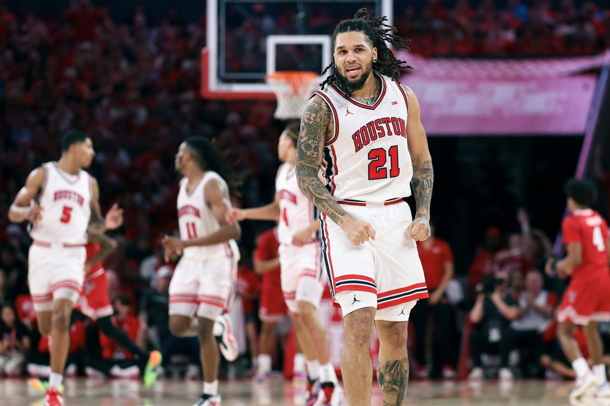 Jan 6, 2026; Houston, Texas, USA; Houston Cougars guard Emanuel Sharp (21) reacts after scoring a basket during the first half against the Texas Tech Red Raiders at Fertitta Center. Mandatory Credit: Troy Taormina-Imagn Images