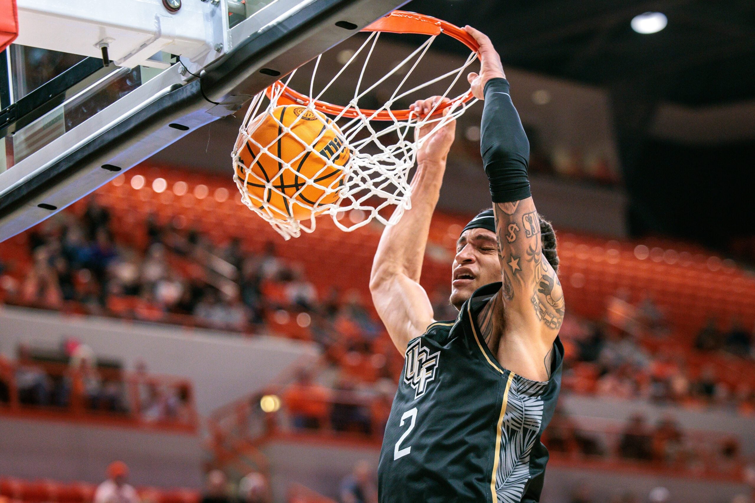 Jan 6, 2026; Stillwater, Oklahoma, USA; UCF Knights guard Riley Kugel (2) dunks the ball during the second half against the Oklahoma State Cowboys at Gallagher-Iba Arena. Mandatory Credit: William Purnell-Imagn Images