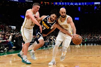 Jan 7, 2026; Boston, Massachusetts, USA; Boston Celtics guard Payton Pritchard (11) fouls Denver Nuggets guard Jamal Murray (27) during the second half at TD Garden. Mandatory Credit: Bob DeChiara-Imagn Images
